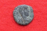 An ancient Roman coin believed to date back to 300- 400 AD, discovered by archaeologists on the site of a Japanese castle.