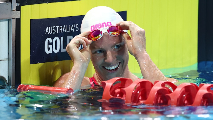 Emily Seebohm smiles as she removes her goggles after a race