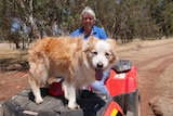 Jenny Whitelock sits on a quadbike with one of her border collies: Kinter.