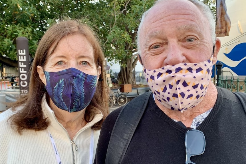 Two people with masks on