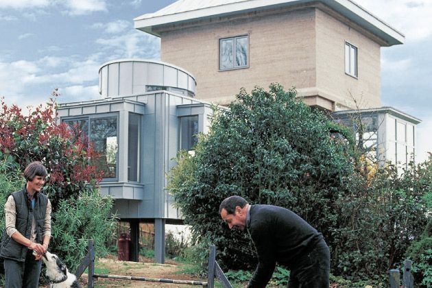 A concrete water tower converted into a house on a rural property in Kent.