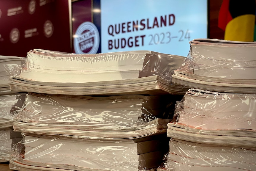 stacks of plastic-wrapped, thick booklets