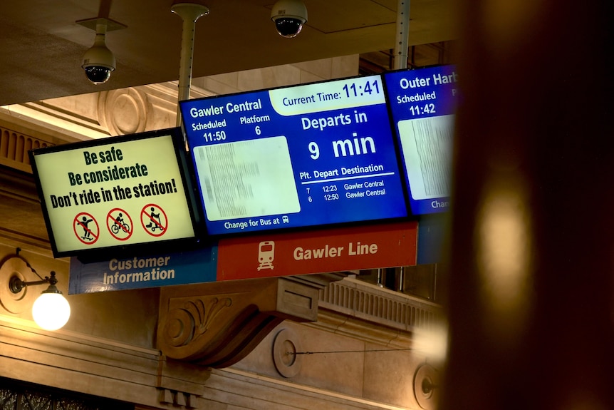 An information screen at Adelaide Railway Station showing departure times.