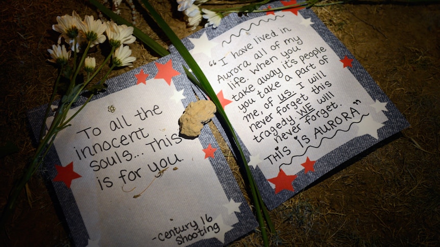 Messages left at the site of a US cinema massacre