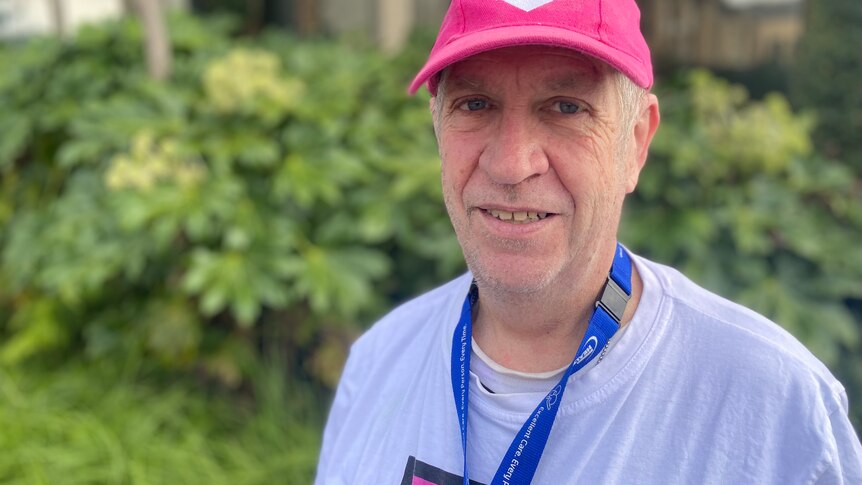 man in his 60s close up top, in a cap promoting organ donation
