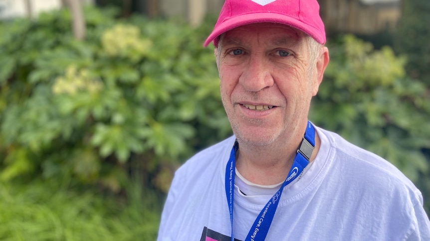 man in his 60s close up top, in a cap promoting organ donation