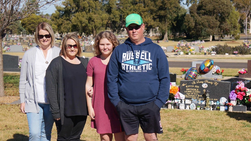 The family at Kevin Swindle's grave site.