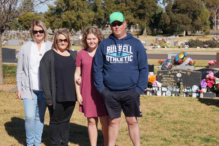 The family at Kevin Swindle's grave site.