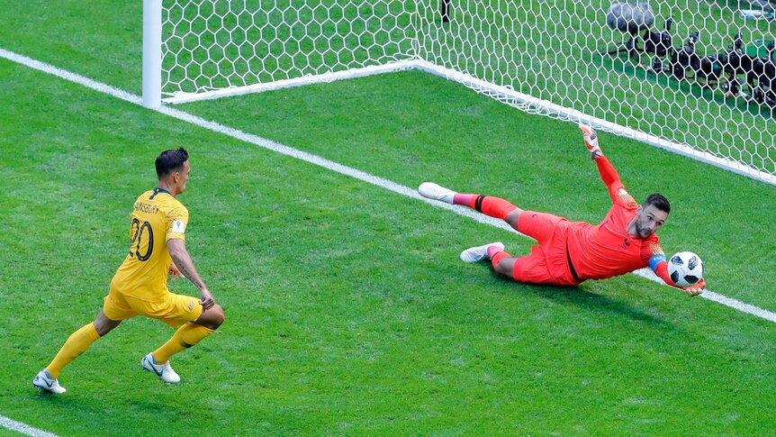 Hugo Lloris watches the ball scoot past his goal against Australia