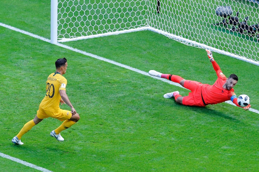 Hugo Lloris watches the ball scoot past his goal against Australia