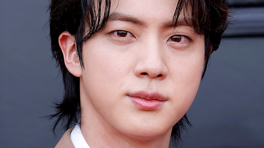 K-pop star Jin of BTS poses for a picture