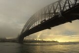 The Sydney Harbour Bridge is shrouded in fog early on Tuesday, June 10, 2008.