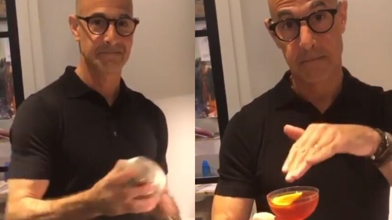 Stanley Tucci shakes a cocktail maker then hold the completed cocktail.