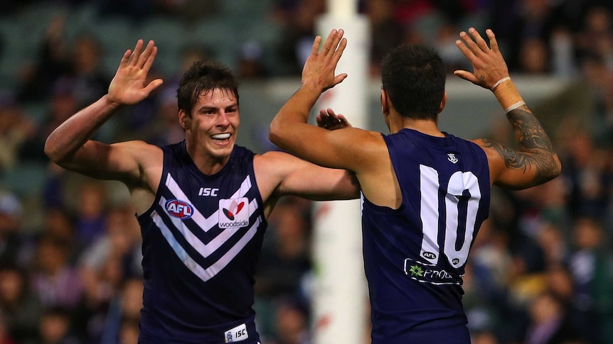 Suban, Walters celebrate a goal