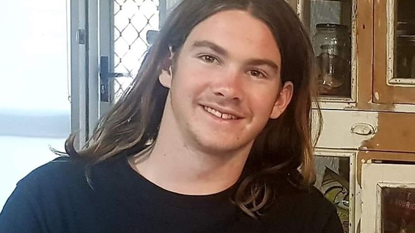 Patrick smiling, wearing a black t-shirt