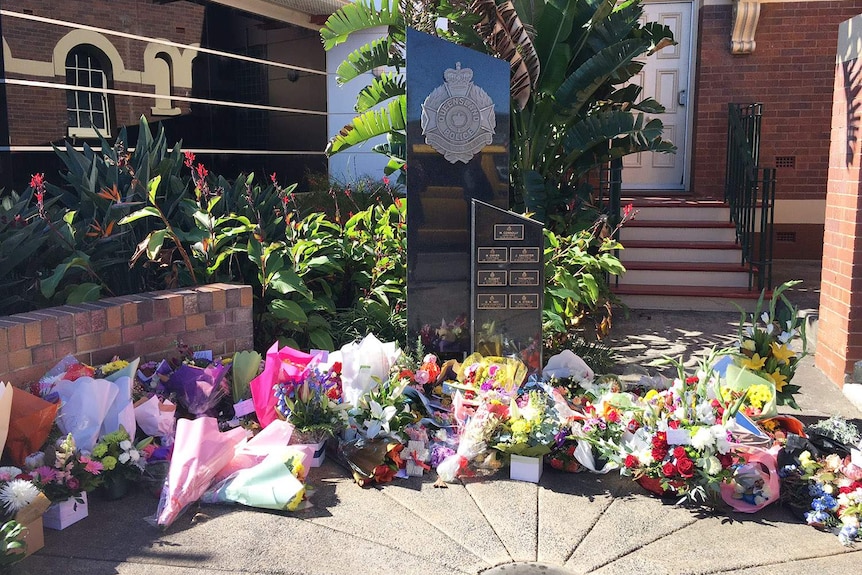 Floral tributes outside Toowoomba police station on May 31, 2017, for Senior Constable Brett Forte