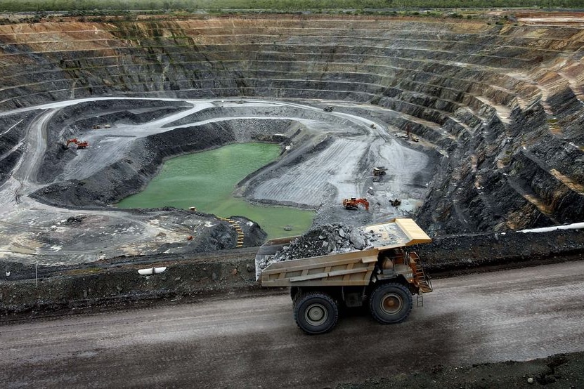 A haul truck carries uranium ore