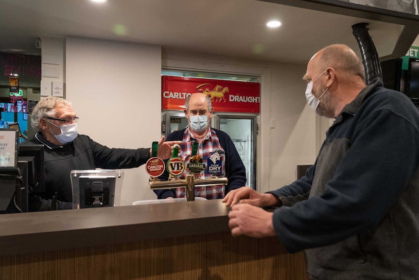 Daryl Ryan, Werribee RSL president, chats with other members.