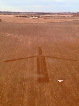 Image of a wind turbine ploughed as a protest