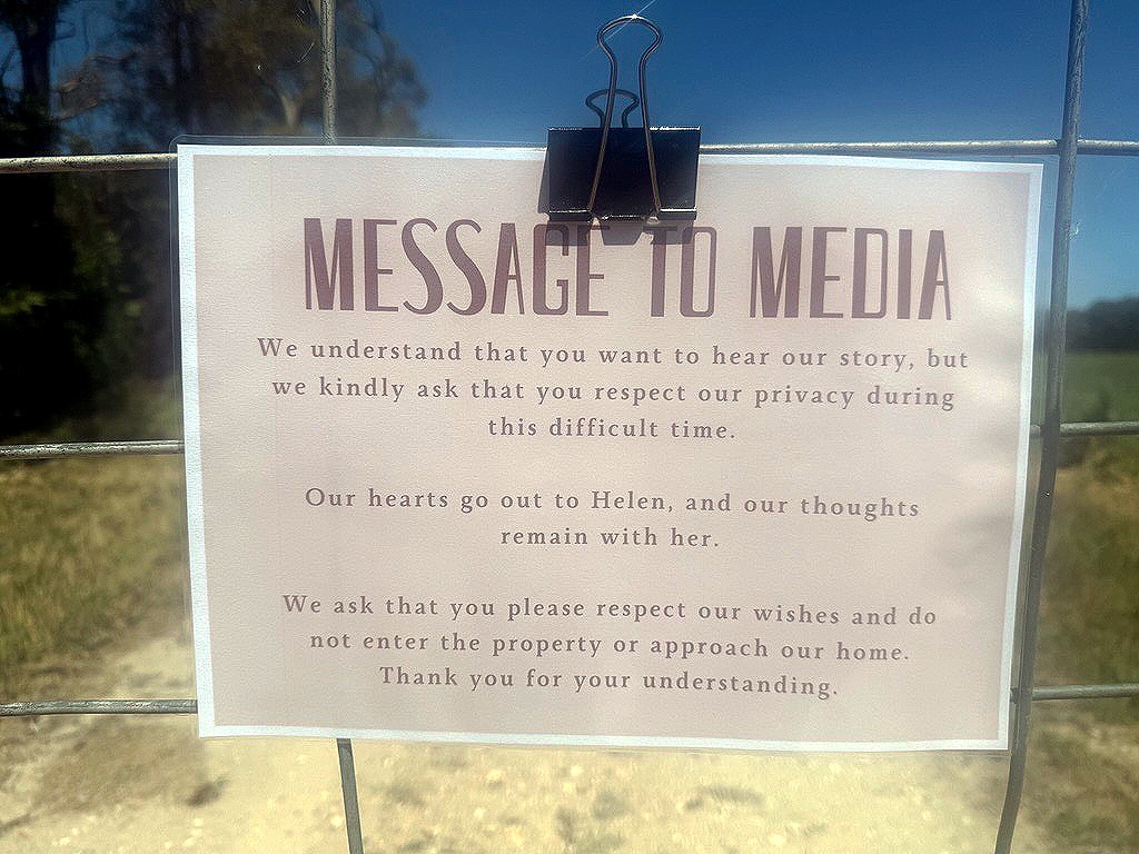 A letter on a gate asking media not to enter a property.