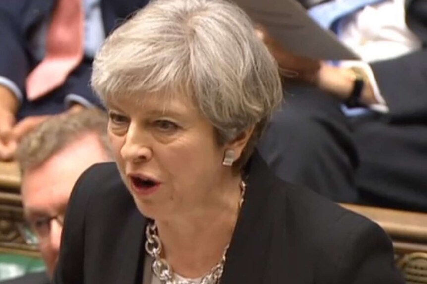 Theresa May points while speaking in the House of Commons.