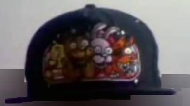 A black cap showing colourful cartoon animals embroidered into the front.