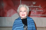 Actress Estelle Harris poses on the red carpet.