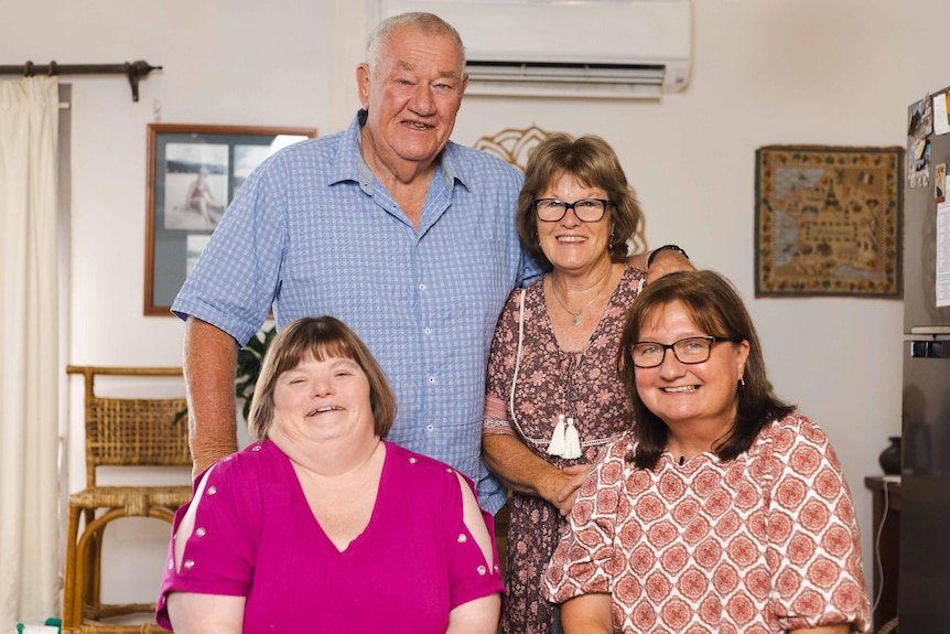 4 people pose for a photo