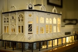 A miniature model of an early 20th century building.