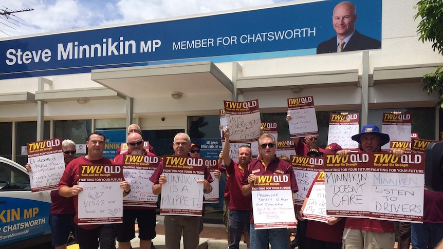 Workers outside Mr Minnikin's office today.