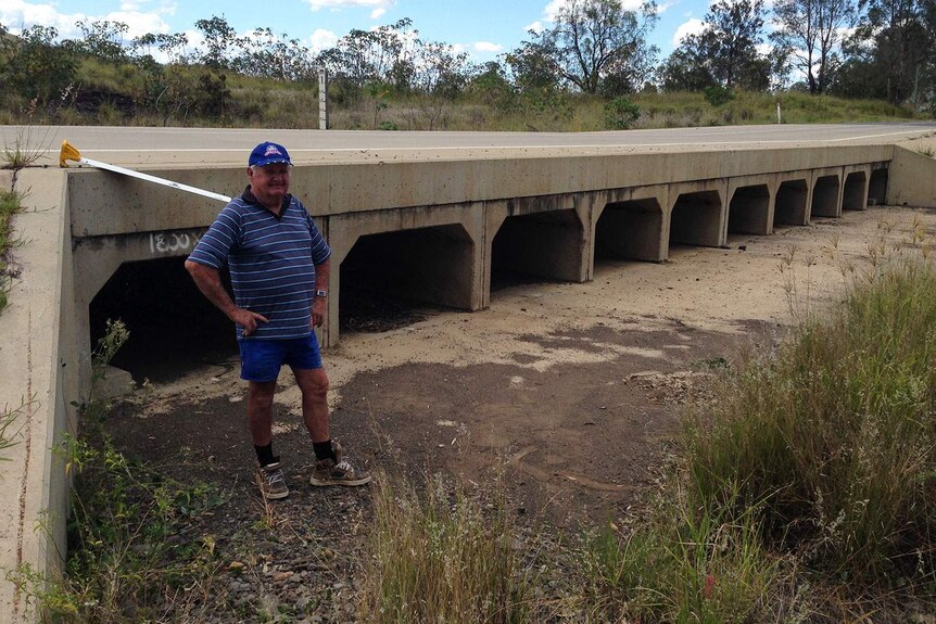 Leon Field at a newly installed concrete culvert crossing a creek bed