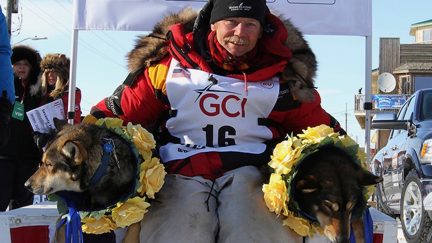 Iditarod champion Mitch Seavey of Sterling, Alaska, poses with his lead dogs