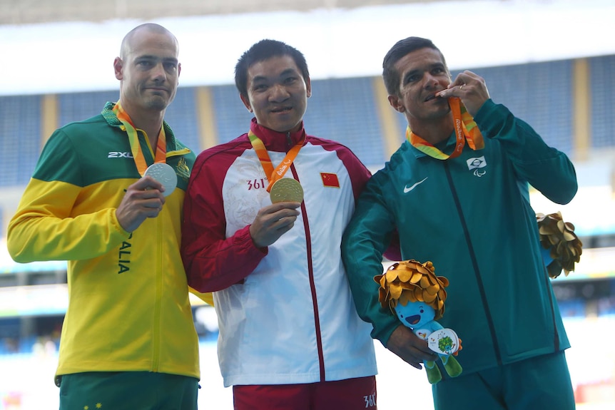 Silver lining ... Evan O'Hanlon alongside Jianwen Hu (C) and Edson Pinheiro on the medal podium in Rio