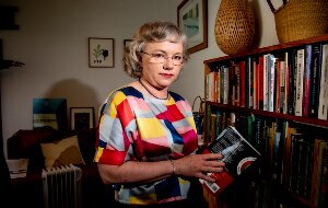 A woman at a book case