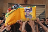 Mourners carry coffin of killed Hezbollah member