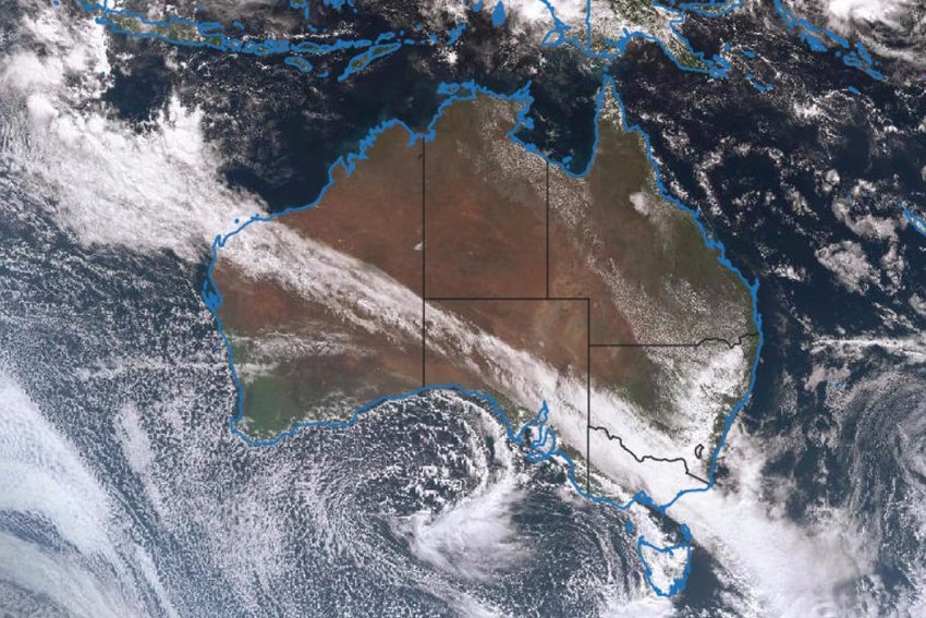 A satellite image of Australia showing a northwest cloud band moving south eastward over Australia.