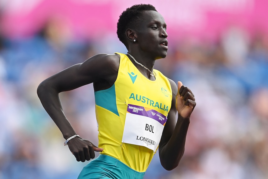 An Australian male athlete runs during a heat of the men's 800 metres at the Commonwealth Games.