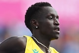 An Australian male athlete runs during a heat of the men's 800 metres at the Commonwealth Games.