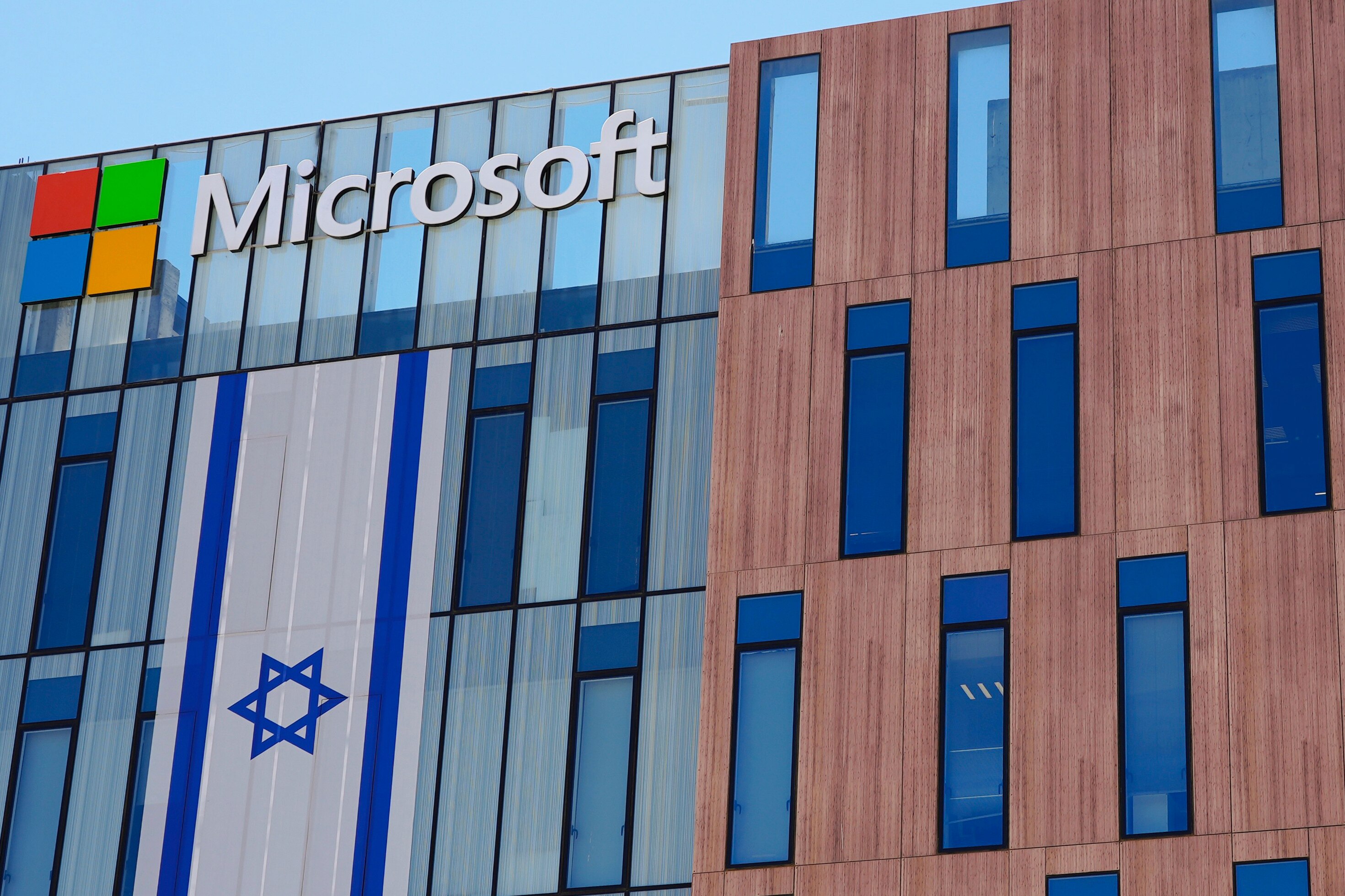 An Israeli flag is draped over the Microsoft offices
