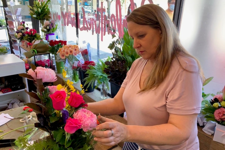 Florist Judy Ann Thomas arranges flowers.