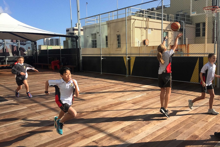 Students playing on the rooftop of St Georges Anglican Grammar School