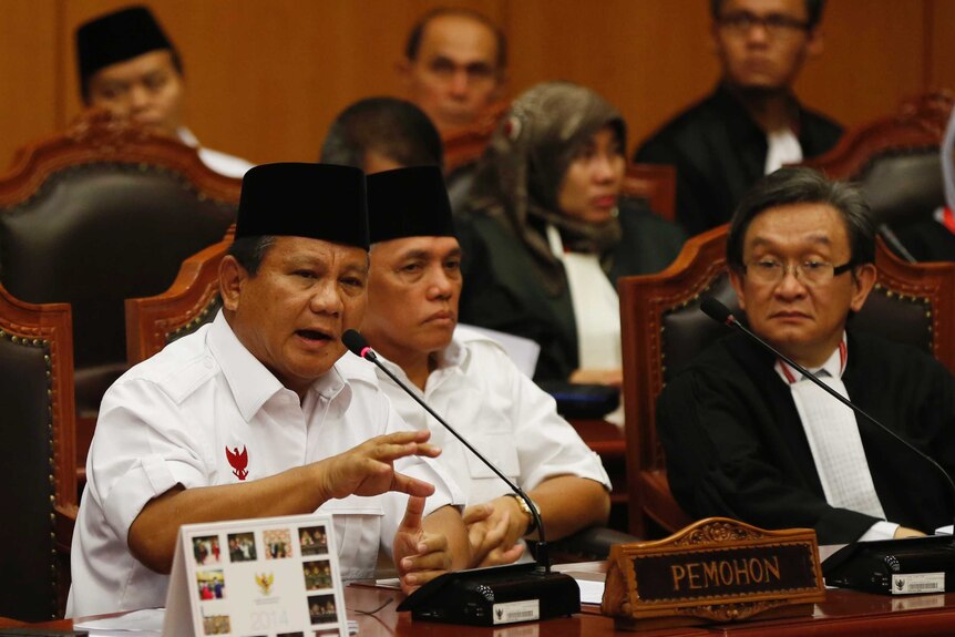 Indonesia's losing presidential candidate Prabowo Subianto addresses the Constitutional Court, Hatta Rajasa listens