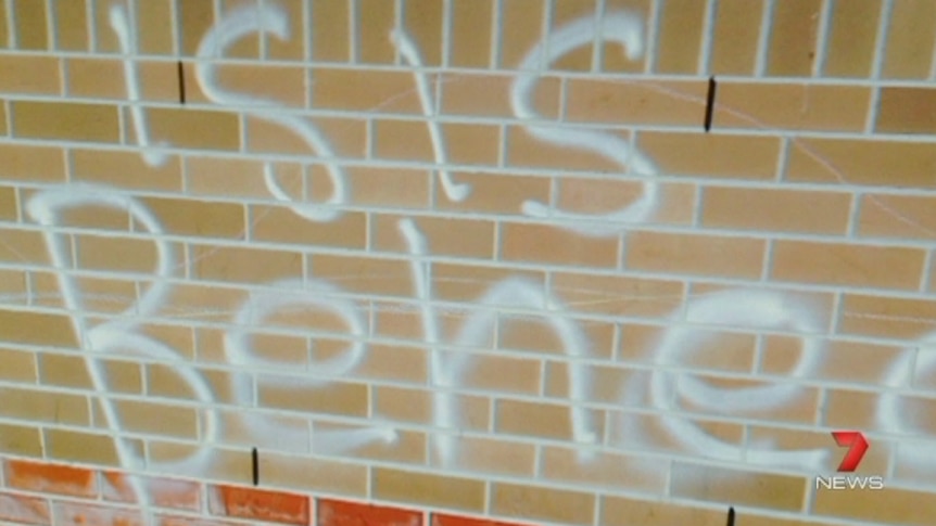 Graffiti sprayed on East Hills Boys High School reads "ISIS beheads"