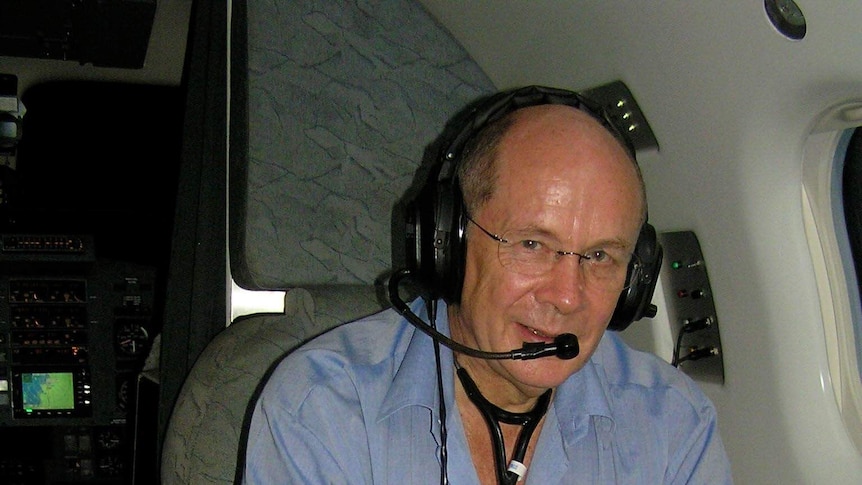Dr Brian Collings on board a RFDS flight.