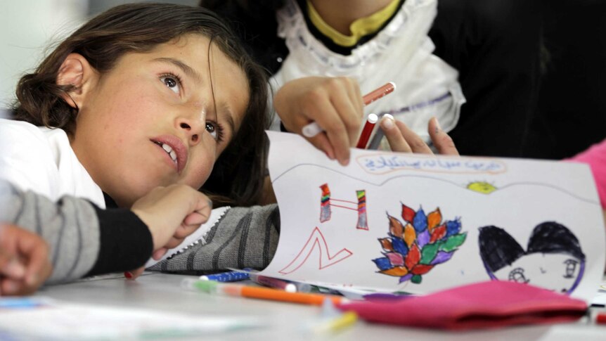 A refugee child take advantage of Ideas Box learning in Jordan camp