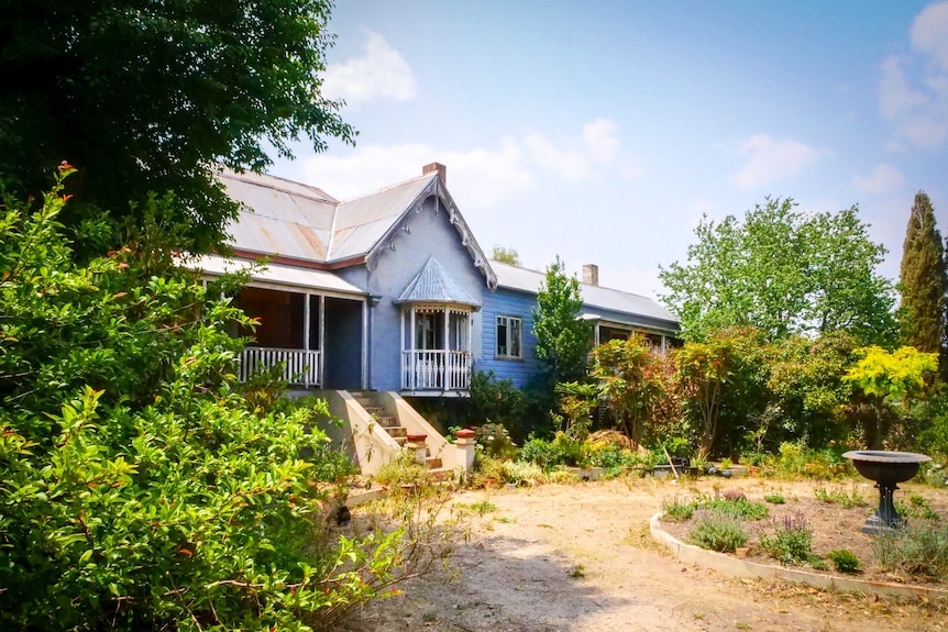 A blue and white gabled home in Uralla which was once part of St Elmo's Private Hospital