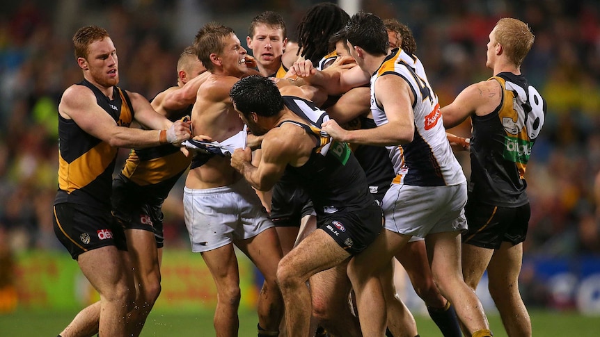 Fiery encounter ... Mark LeCras remonstrates with Richmond players