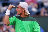 Lleyton Hewitt celebrates winning the first set tiebreak against Andy Roddick