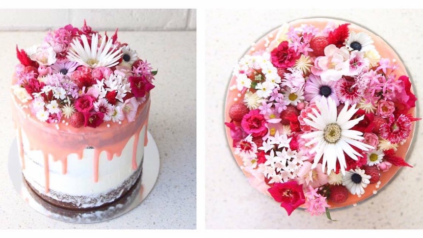 A cake decorated with pink and white edible flowers.