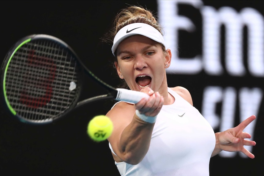 Simona Halep opens her mouth as she hits a forehand at the Australian Open.